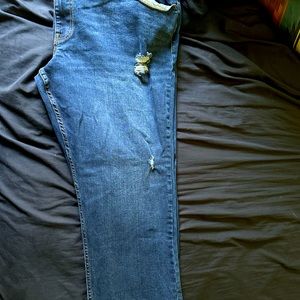 Men’s Big and Tall Athletic Flex 360 distressed blue jeans.
